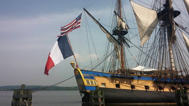 The L'Hermoine proudly displaying the flags of both the United States and France. 